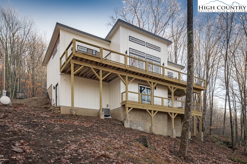 232 Wild Daisy Lane Beech Mountain, NC 28604 - Photo 47 of 49 a view of a house with a patio