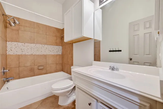 a bathroom with a sink a toilet and a bathtub