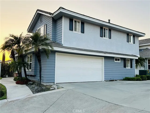 a front view of a house with a garage