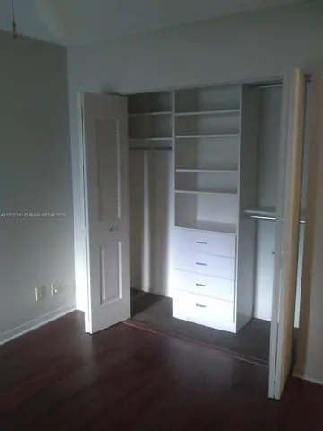 an empty room with a empty space and a window