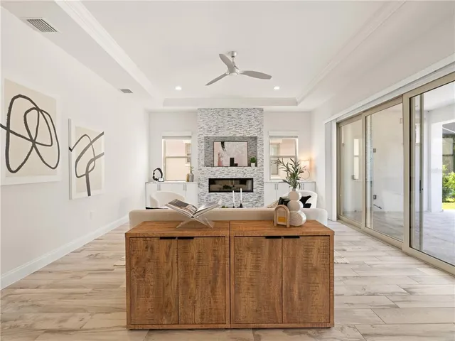 a living room with furniture and a fireplace