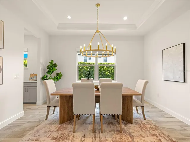 a view of a dining room with furniture window and outside view