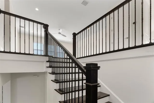 a view of staircase with wooden floor and a window