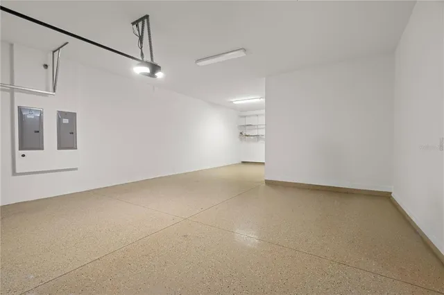 a view of a big room with carpet and windows