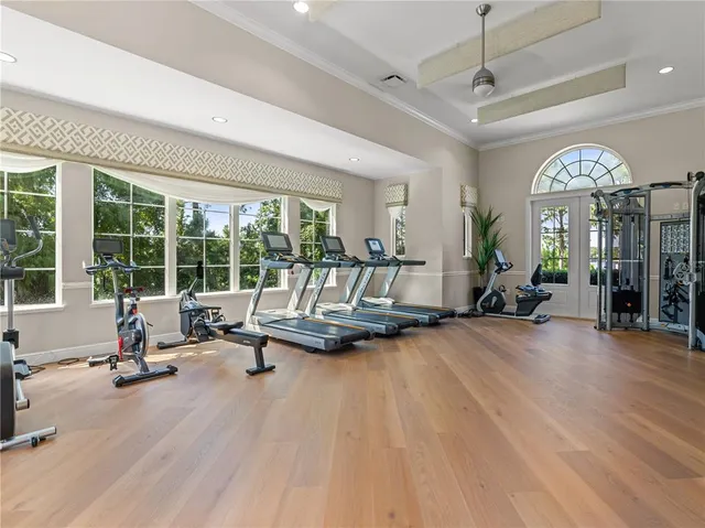 a living room with furniture and large windows