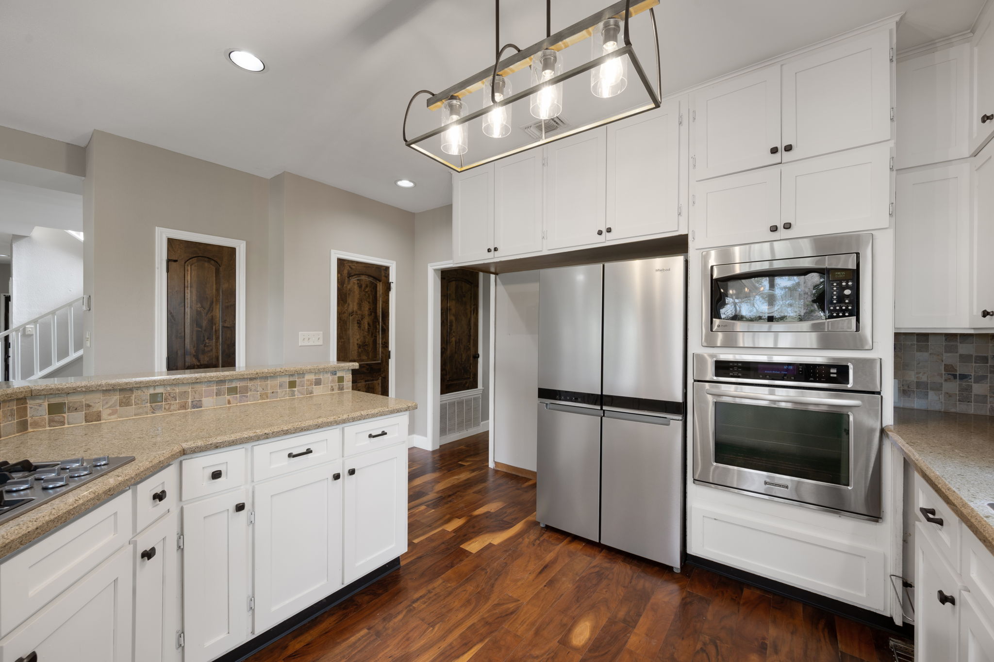 330 County Road 166 Georgetown, TX 78626 - Photo 12 of 40 a kitchen with a refrigerator and white cabinets