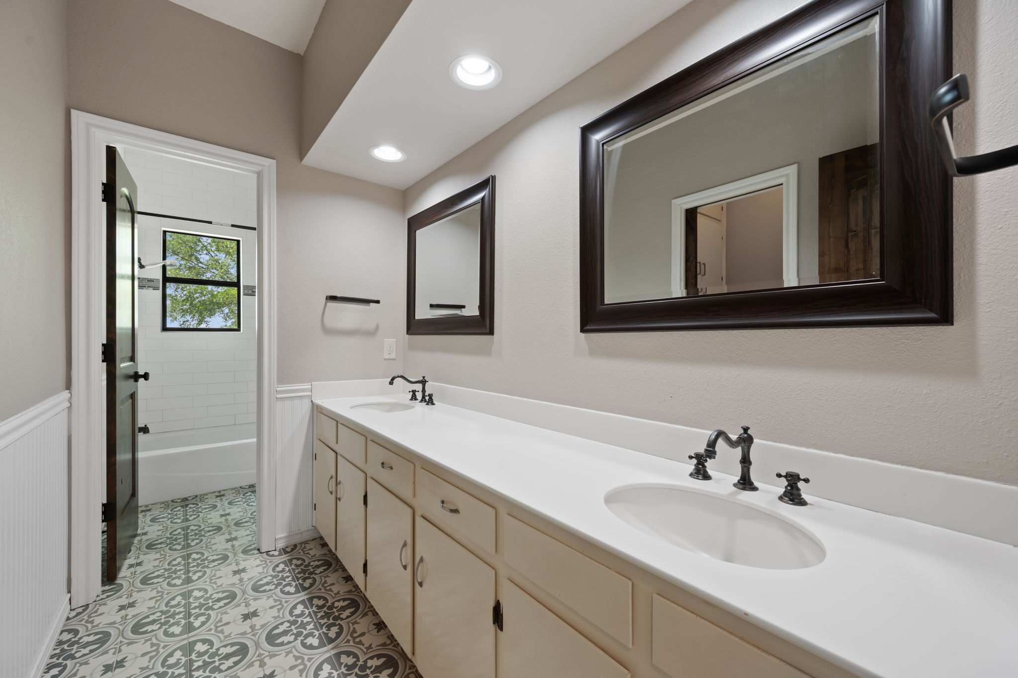 330 County Road 166 Georgetown, TX 78626 - Photo 20 of 40 a spacious bathroom with a double vanity sink and a mirror