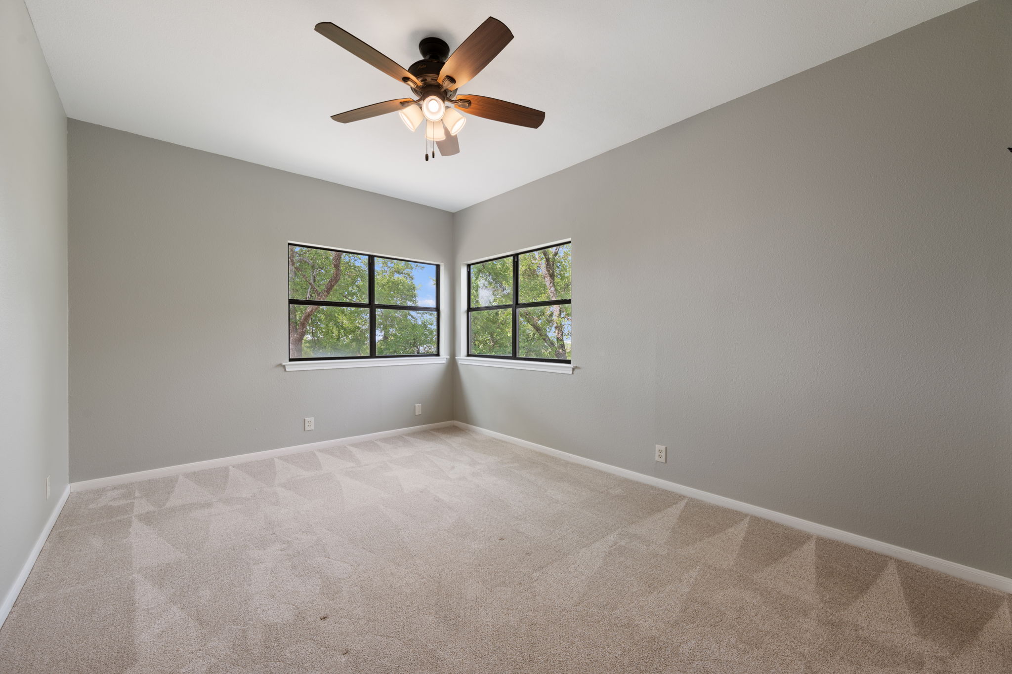 330 County Road 166 Georgetown, TX 78626 - Photo 21 of 40 an empty room with windows and ceiling fan