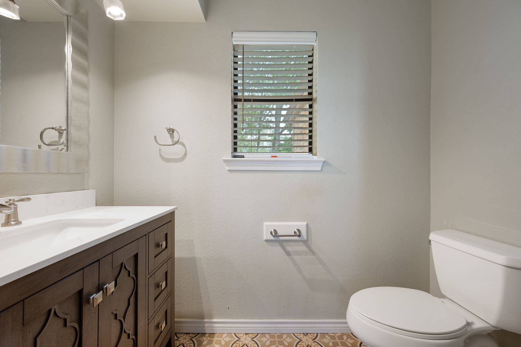 330 County Road 166 Georgetown, TX 78626 - Photo 23 of 40 a bathroom with a sink a toilet and a window