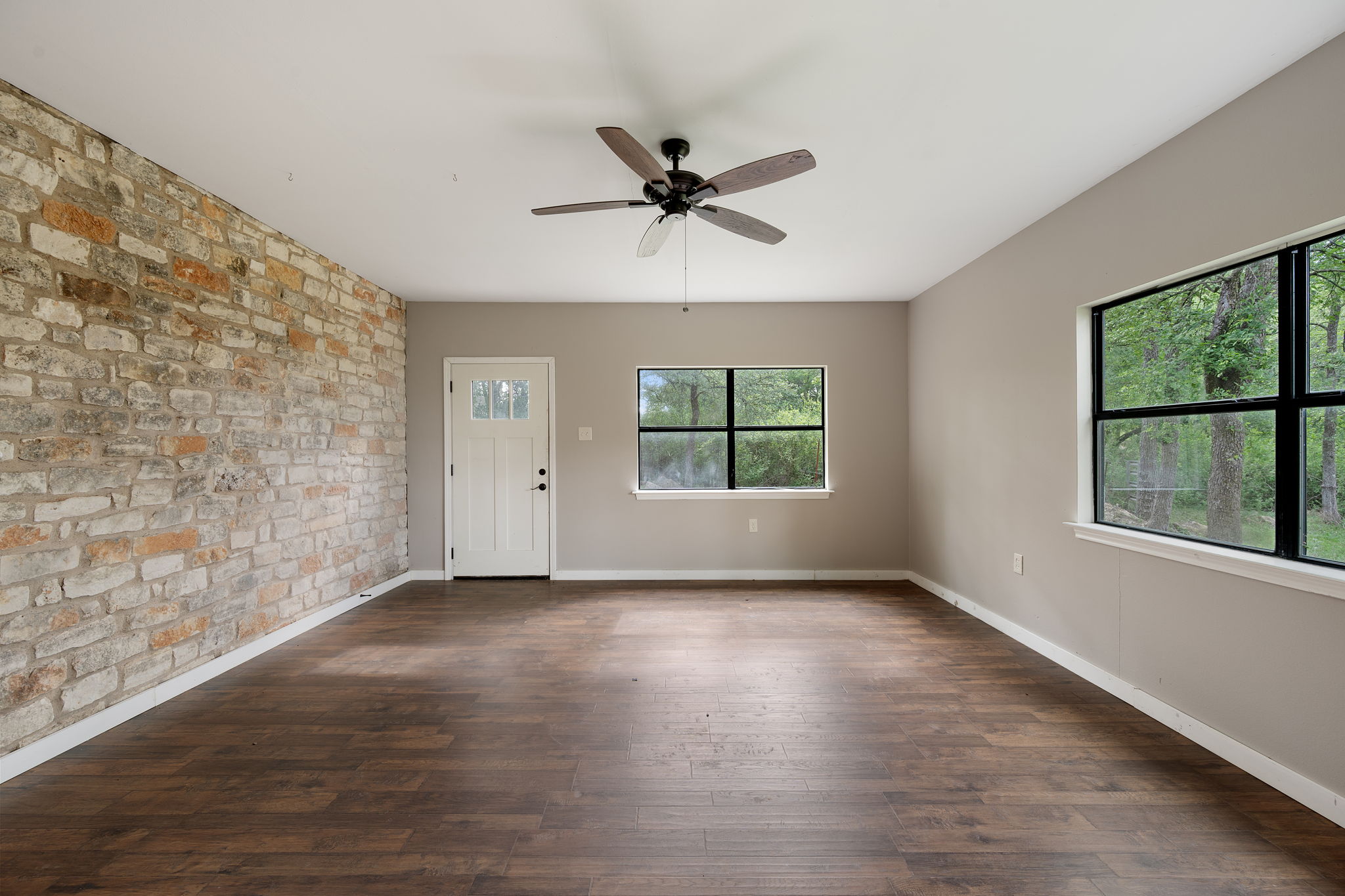 330 County Road 166 Georgetown, TX 78626 - Photo 24 of 40 wooden floor in an empty room with a window