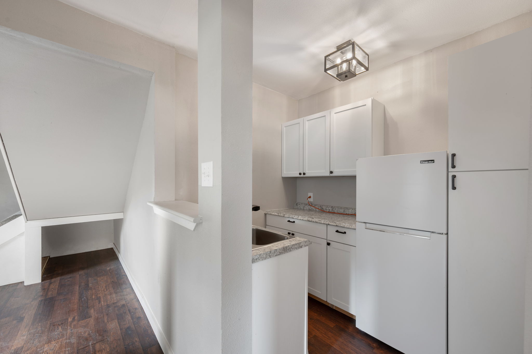 330 County Road 166 Georgetown, TX 78626 - Photo 34 of 40 a kitchen with a refrigerator a stove top oven and cabinets