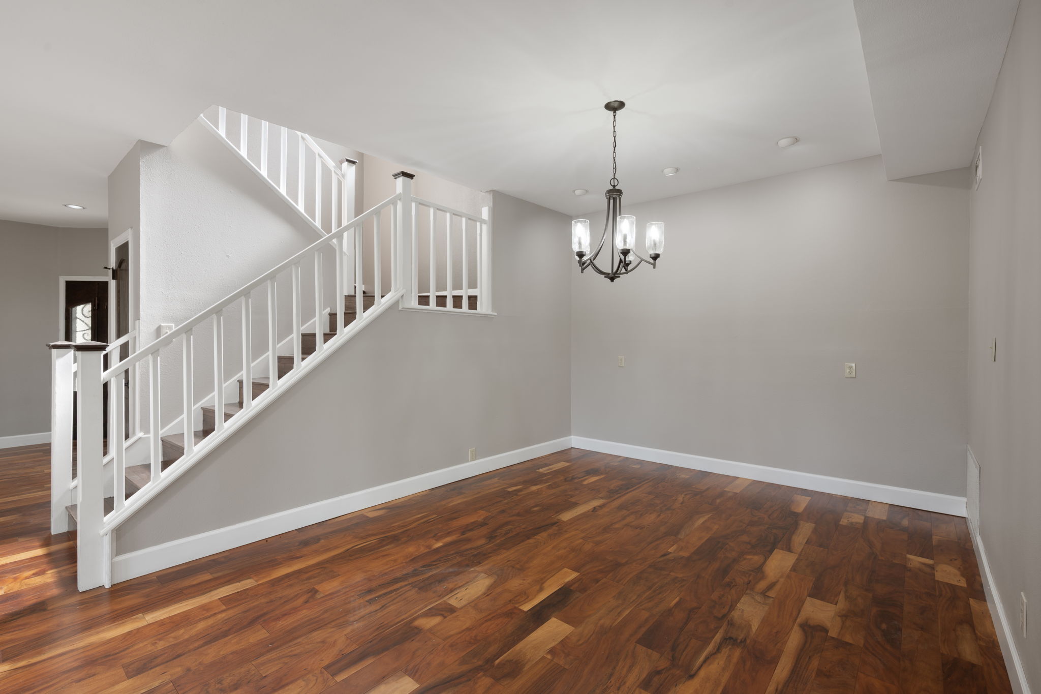 330 County Road 166 Georgetown, TX 78626 - Photo 9 of 40 a view of a room with wooden floor staircase and a chandelier