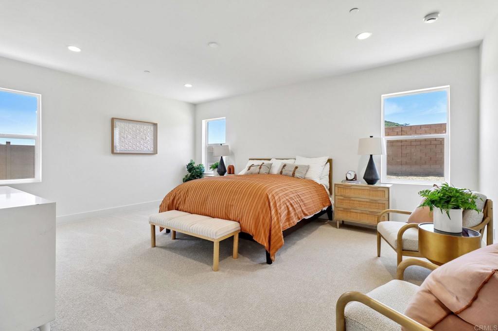 3521 Butler Place Escondido, CA 92027 - Photo 28 of 50 a spacious bedroom with a bed and ceiling fan