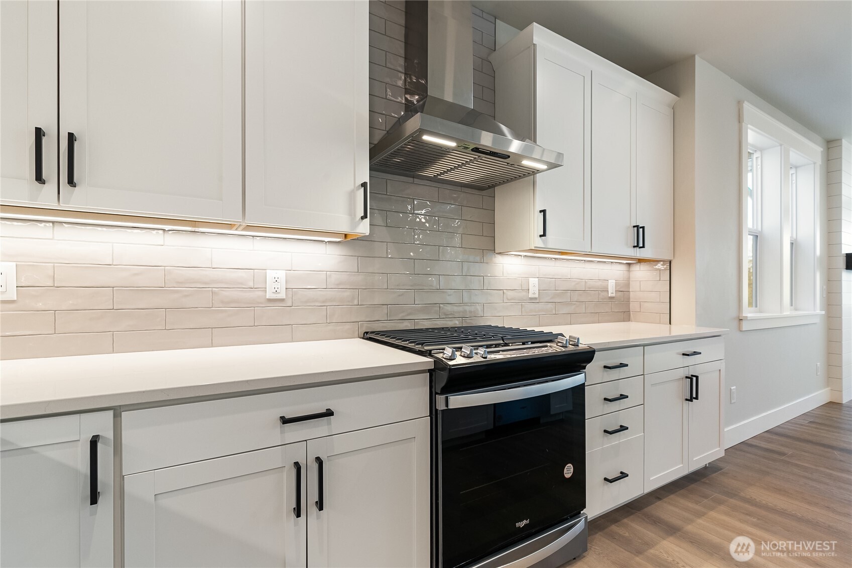5984 Ranch Loop Ferndale, WA 98248 - Photo 12 of 37 a kitchen with stainless steel appliances granite countertop white cabinets and a stove