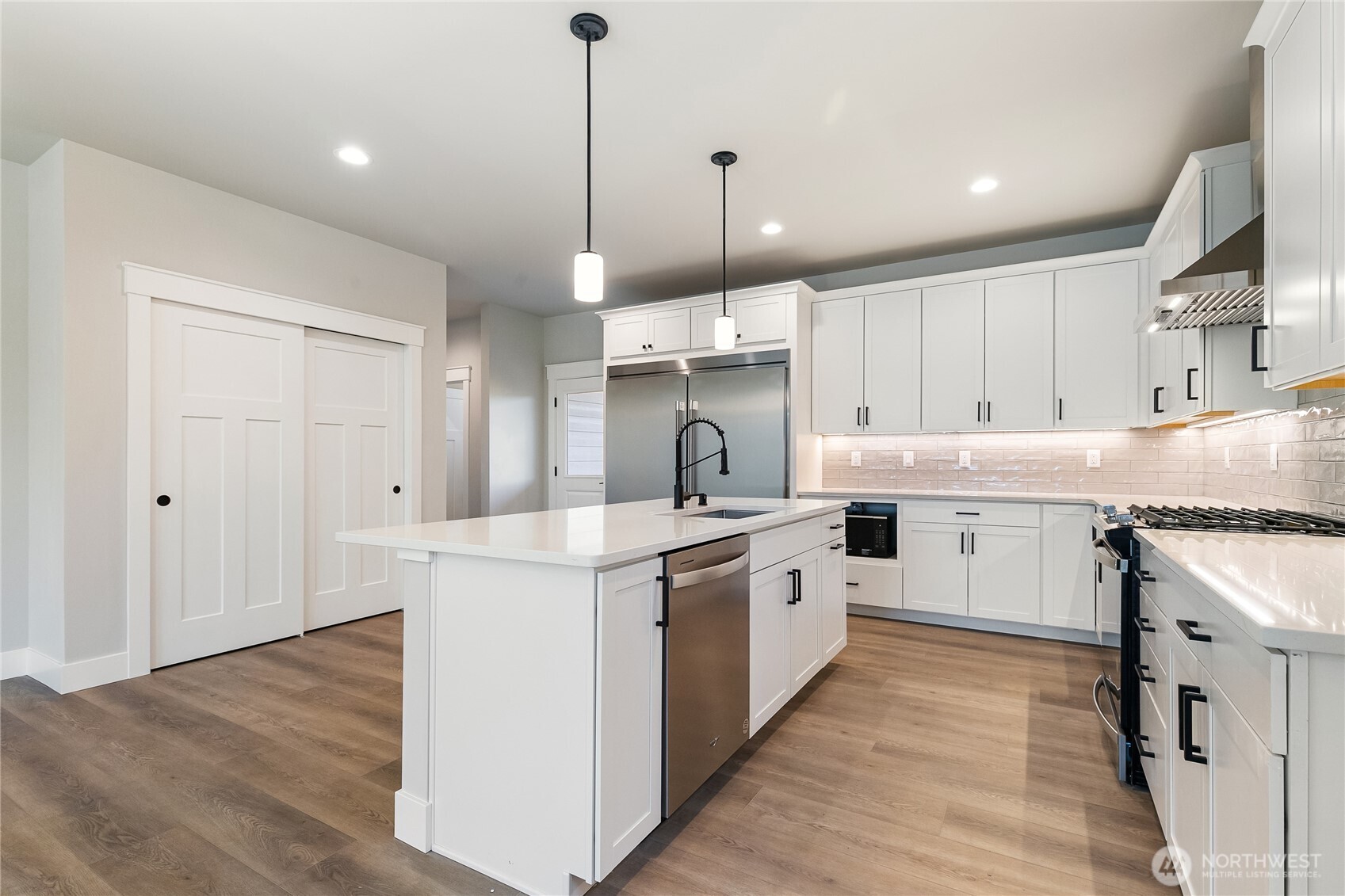 5984 Ranch Loop Ferndale, WA 98248 - Photo 13 of 37 a kitchen with stove top oven and cabinets