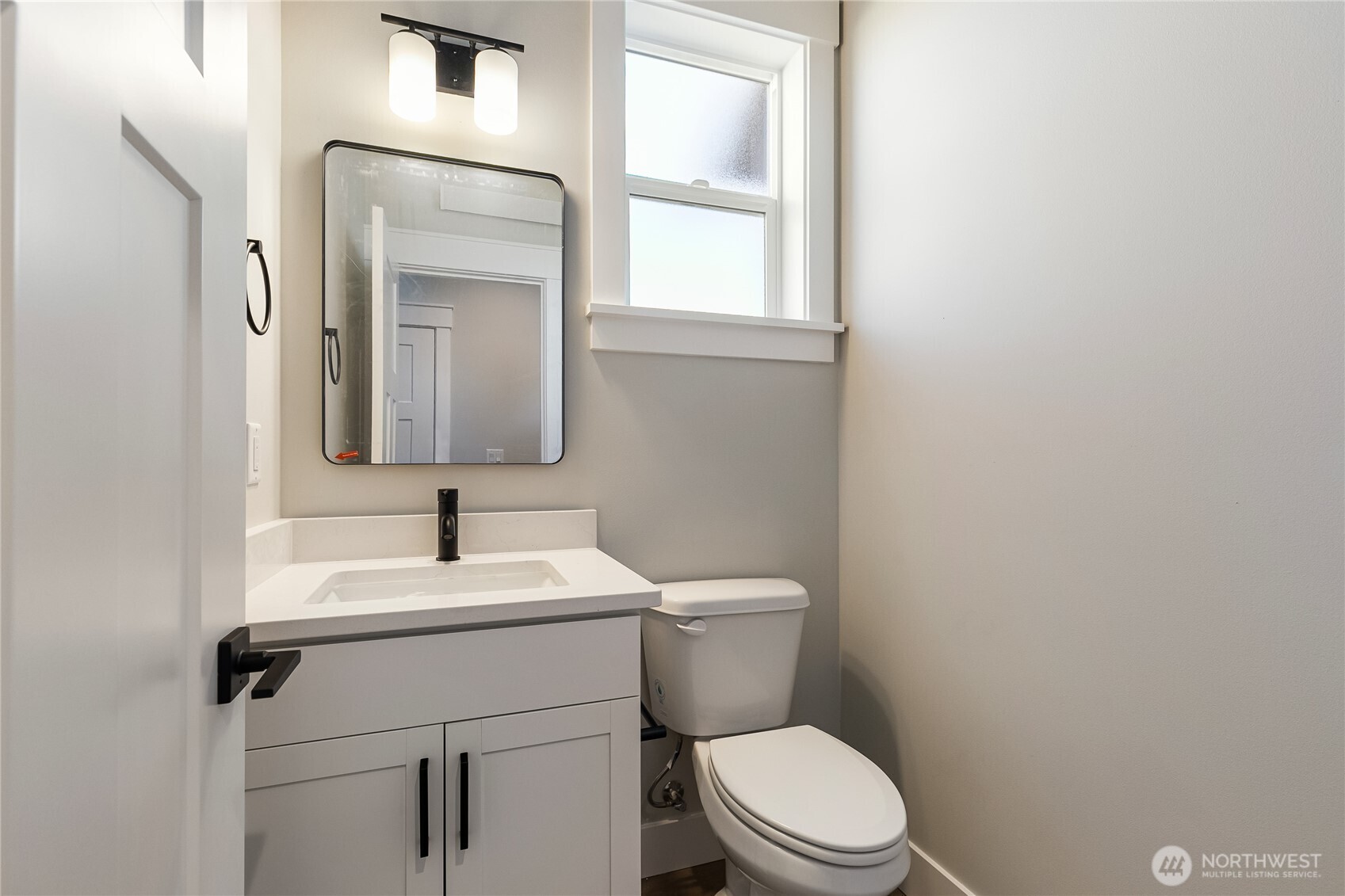 5984 Ranch Loop Ferndale, WA 98248 - Photo 14 of 37 a bathroom with a toilet sink and mirror