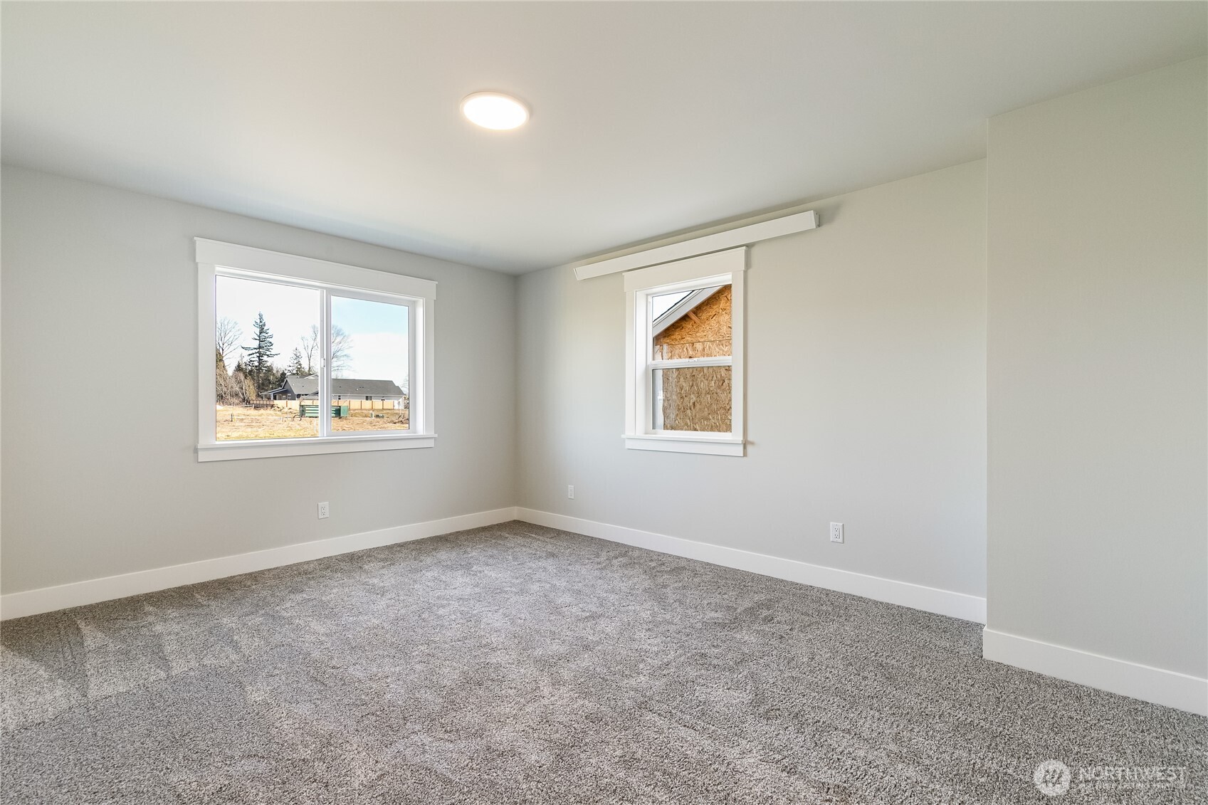 5984 Ranch Loop Ferndale, WA 98248 - Photo 19 of 37 an empty room with windows and closet