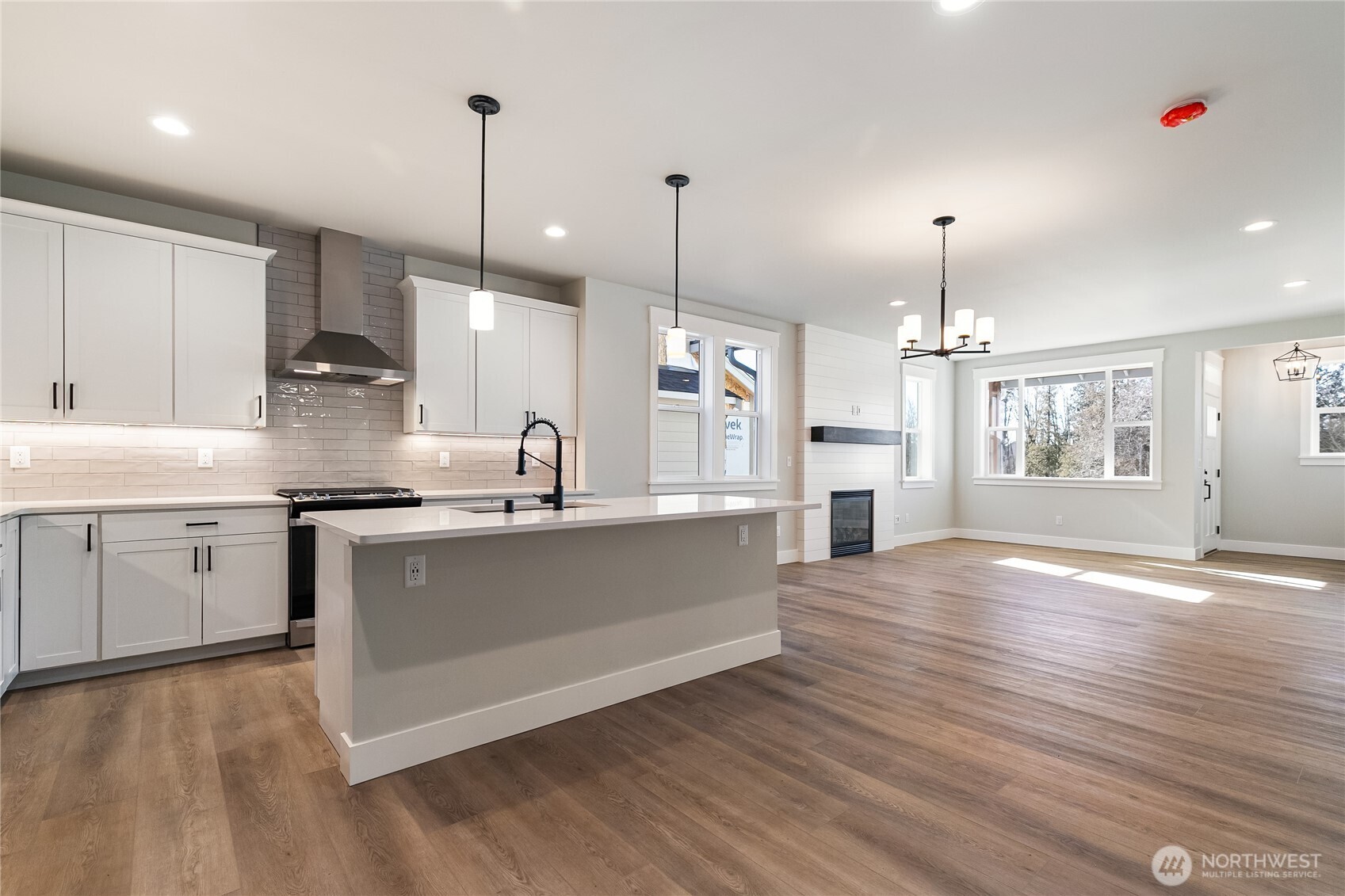 5984 Ranch Loop Ferndale, WA 98248 - Photo 7 of 37 a kitchen with stainless steel appliances granite countertop a sink cabinets a stove and a refrigerator