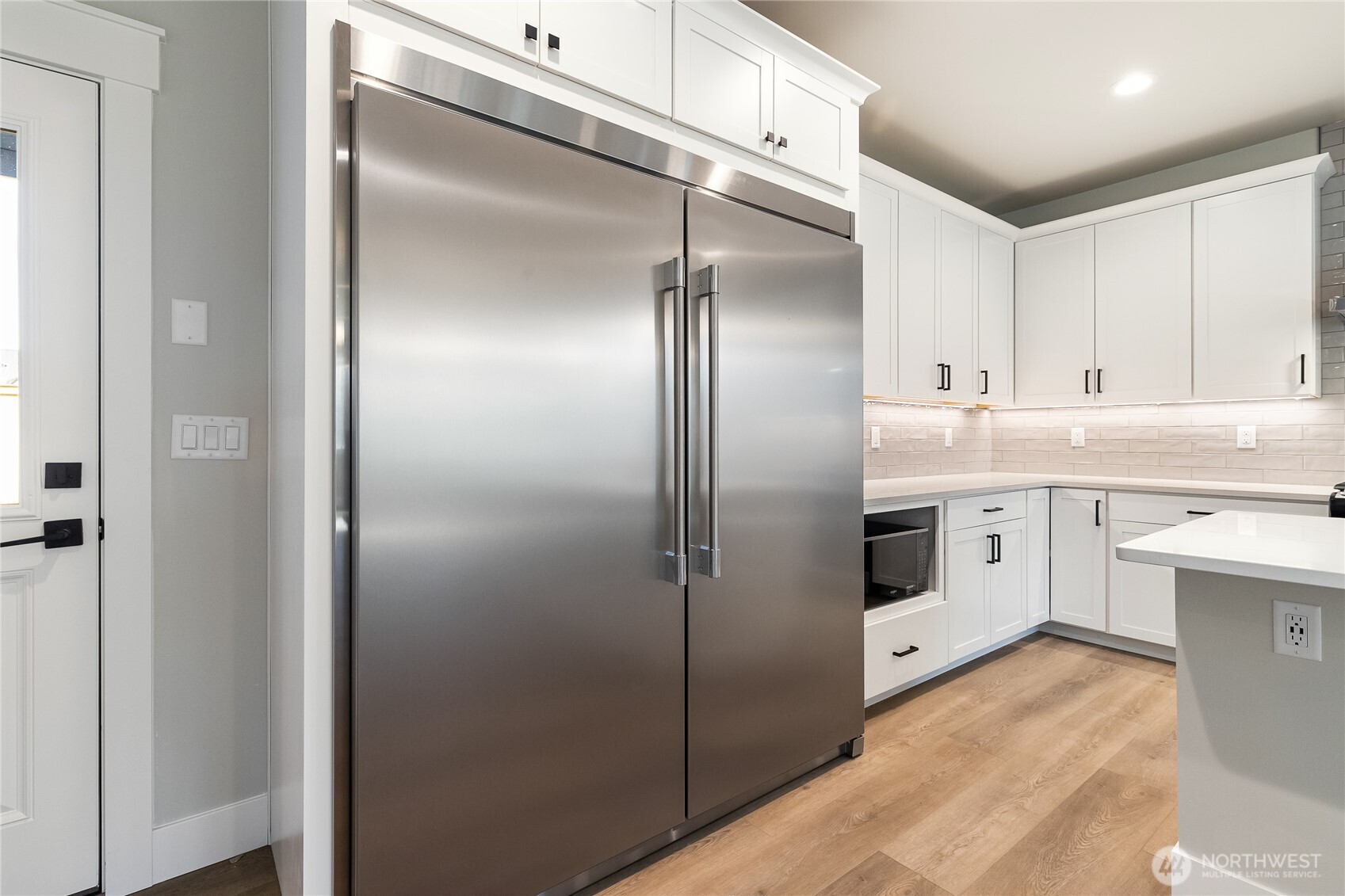 5984 Ranch Loop Ferndale, WA 98248 - Photo 10 of 37 a kitchen with cabinets stainless steel appliances and counter space