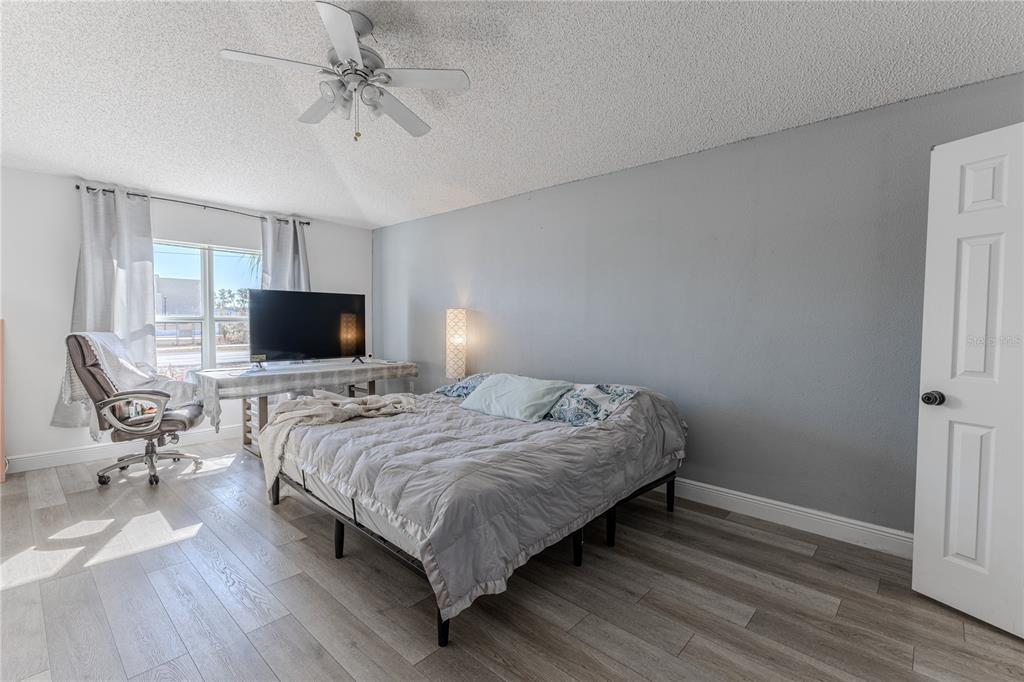 5437 Freeport Drive Spring Hill, FL 34606 - Photo 13 of 34 a bedroom with a bed and a flat screen tv