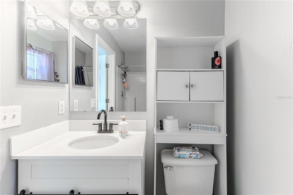 5437 Freeport Drive Spring Hill, FL 34606 - Photo 14 of 34 a bathroom with a sink and a mirror