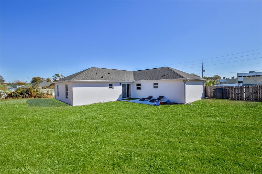 5437 Freeport Drive Spring Hill, FL 34606 - Photo 32 of 34 a view of a backyard with a garden and plants