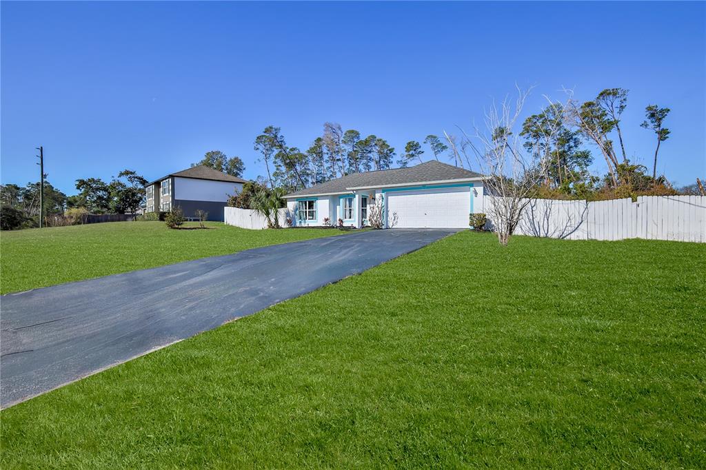 5437 Freeport Drive Spring Hill, FL 34606 - Photo 33 of 34 a view of a yard in front of a house with a yard
