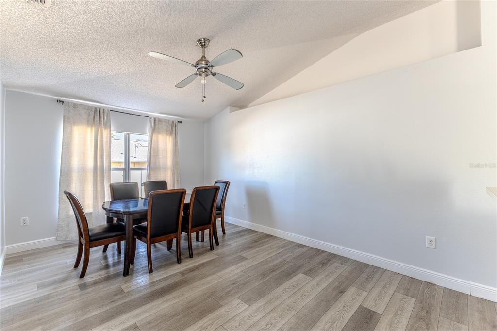 5437 Freeport Drive Spring Hill, FL 34606 - Photo 5 of 34 a view of a dining room with furniture window and wooden floor
