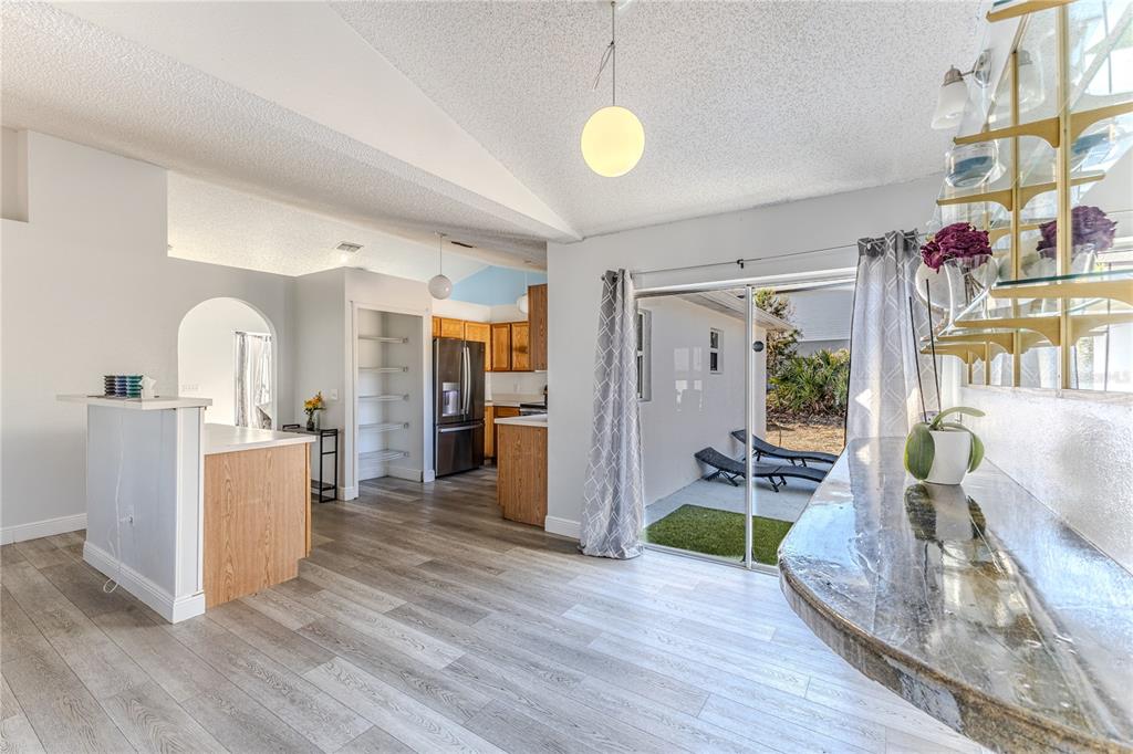 5437 Freeport Drive Spring Hill, FL 34606 - Photo 8 of 34 a view of kitchen with furniture and wooden floor