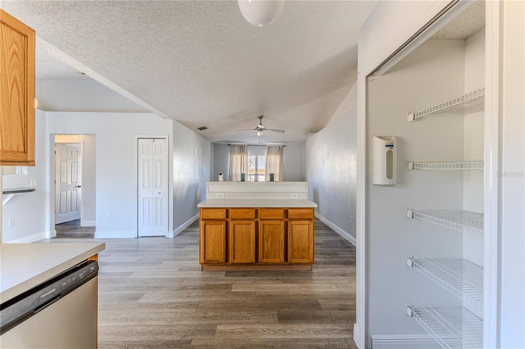 5437 Freeport Drive Spring Hill, FL 34606 - Photo 10 of 34 a view of a kitchen cabinets and wooden floor