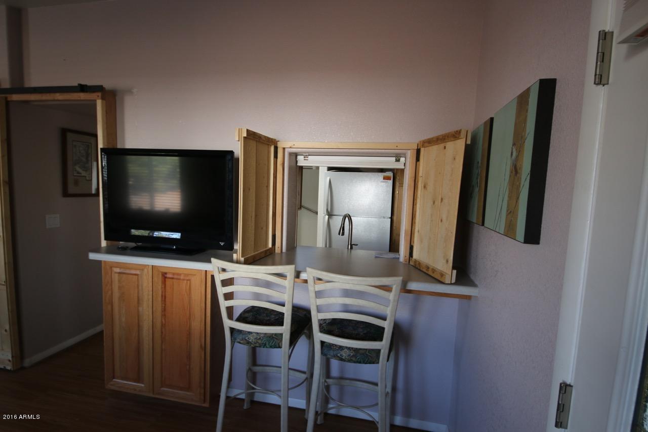 2216 Rodeo Road Overgaard, AZ 85933 - Photo 12 of 41 Kitchen Pass Through