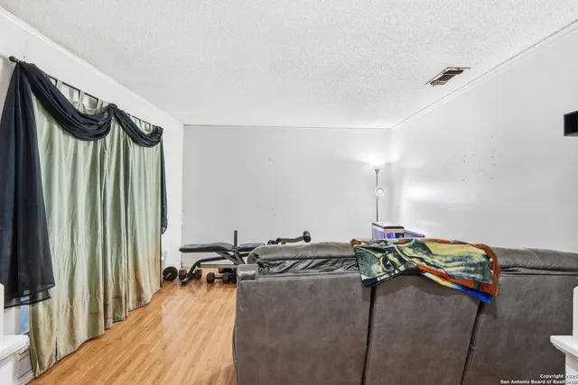 a bedroom with a bed and a mirror