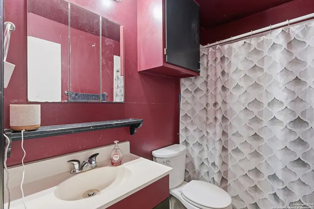 a bathroom with a sink and a toilet