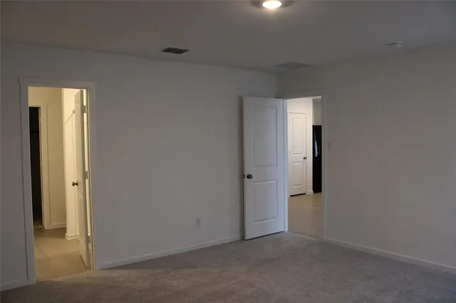an empty room with closet area