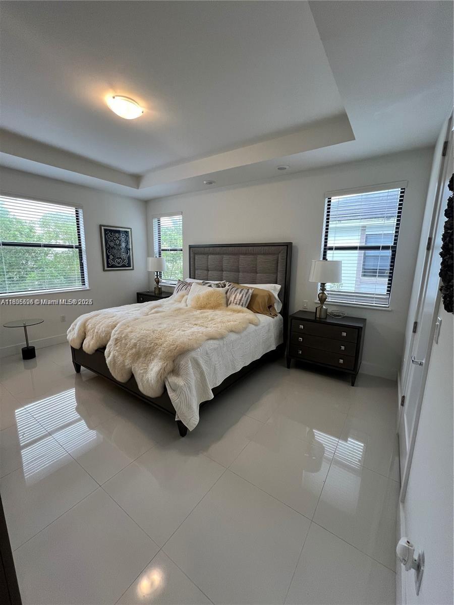 Kendall Miami, FL 33186 - Photo 16 of 30 a bedroom with a bed and window