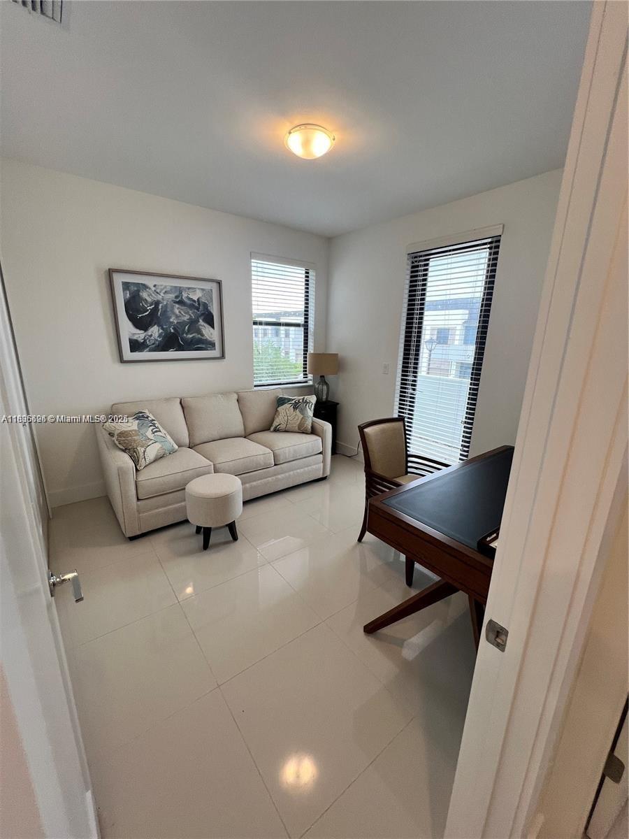 Kendall Miami, FL 33186 - Photo 23 of 30 a living room with furniture and a window