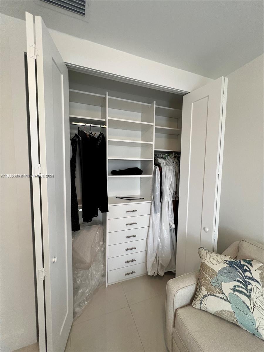 Kendall Miami, FL 33186 - Photo 24 of 30 a view of walk in closet with clothes
