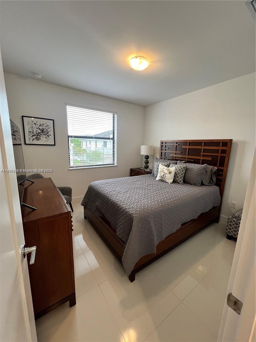 Kendall Miami, FL 33186 - Photo 26 of 30 a bedroom with a bed and window