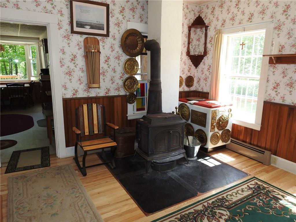 119 River Road Canton, ME 04221 - Photo 13 of 35 Den or dining room, woodstove