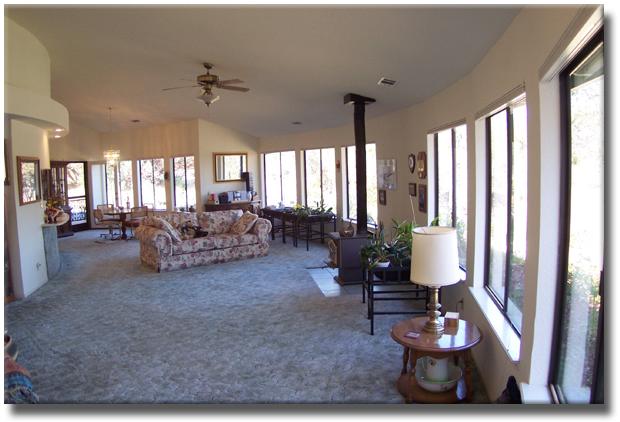 12583 Intermountain Road Redding, CA 96003 - Photo 4 of 5 a living room with furniture and a large window