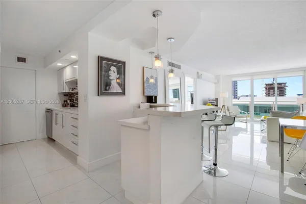 a kitchen with cabinets and window