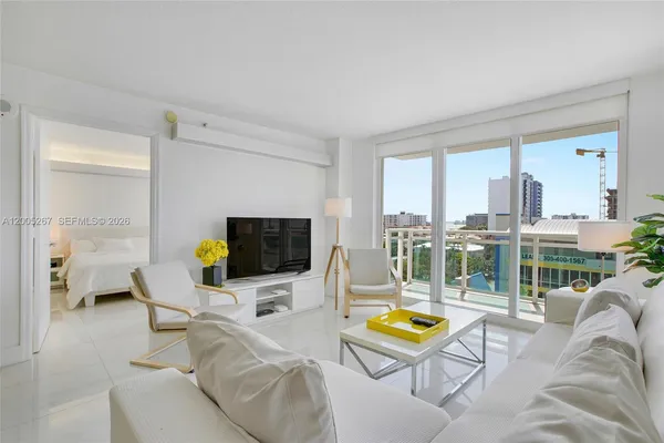 a living room with furniture and a flat screen tv
