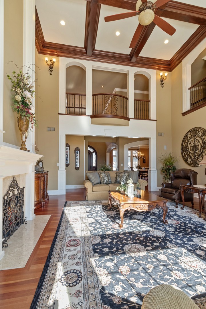 10911 Royal Oaks Lane Orland Park, IL 60467 - Photo 14 of 29 a living room with furniture or couch and a fireplace
