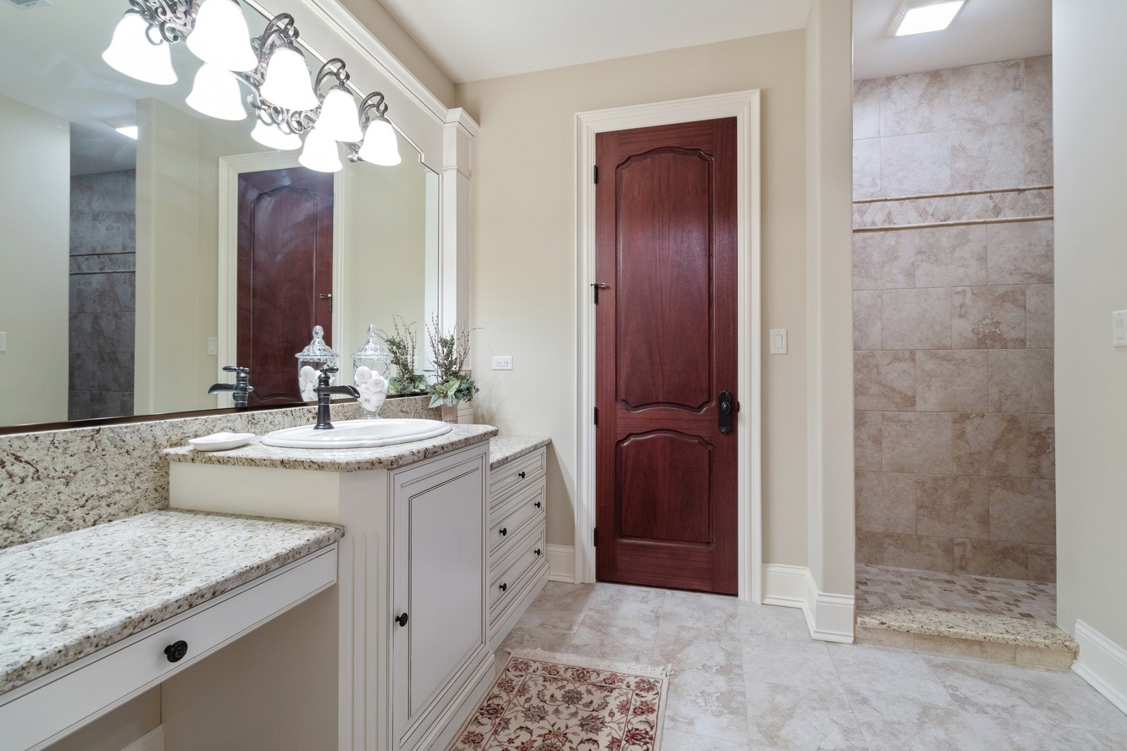 10911 Royal Oaks Lane Orland Park, IL 60467 - Photo 21 of 29 a bathroom with a granite countertop sink a mirror and a shower