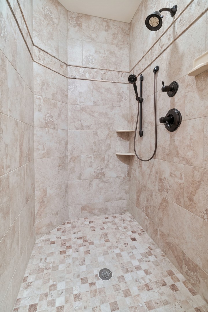 10911 Royal Oaks Lane Orland Park, IL 60467 - Photo 22 of 29 a bathroom with a shower