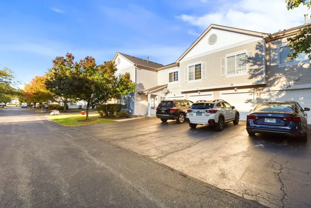 a view of a cars parked in front of a house