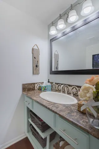 a bathroom with a sink and a mirror