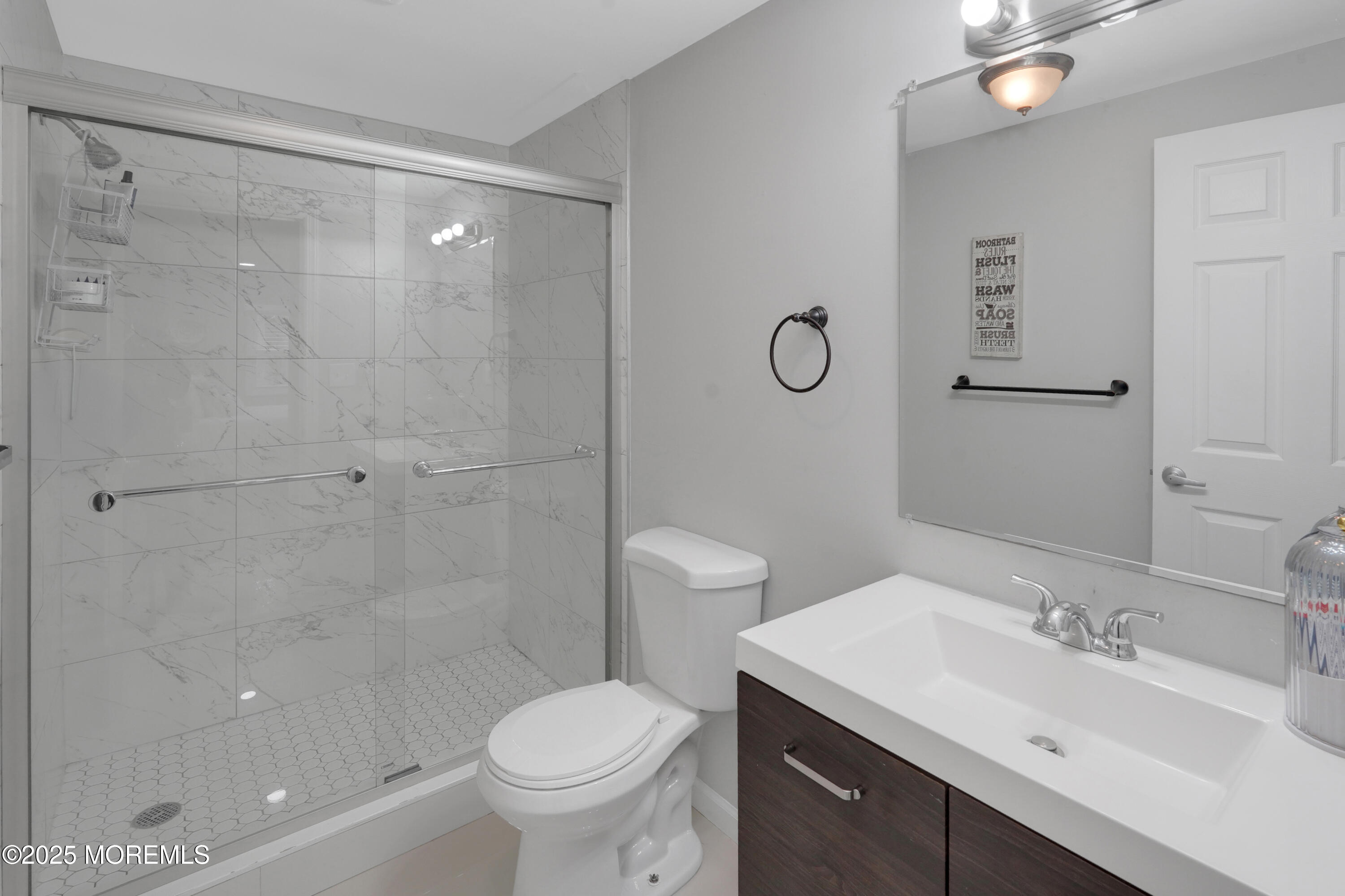 336 Jackson Mills Road Jackson, NJ 08527 - Photo 23 of 45 a bathroom with a sink toilet and shower