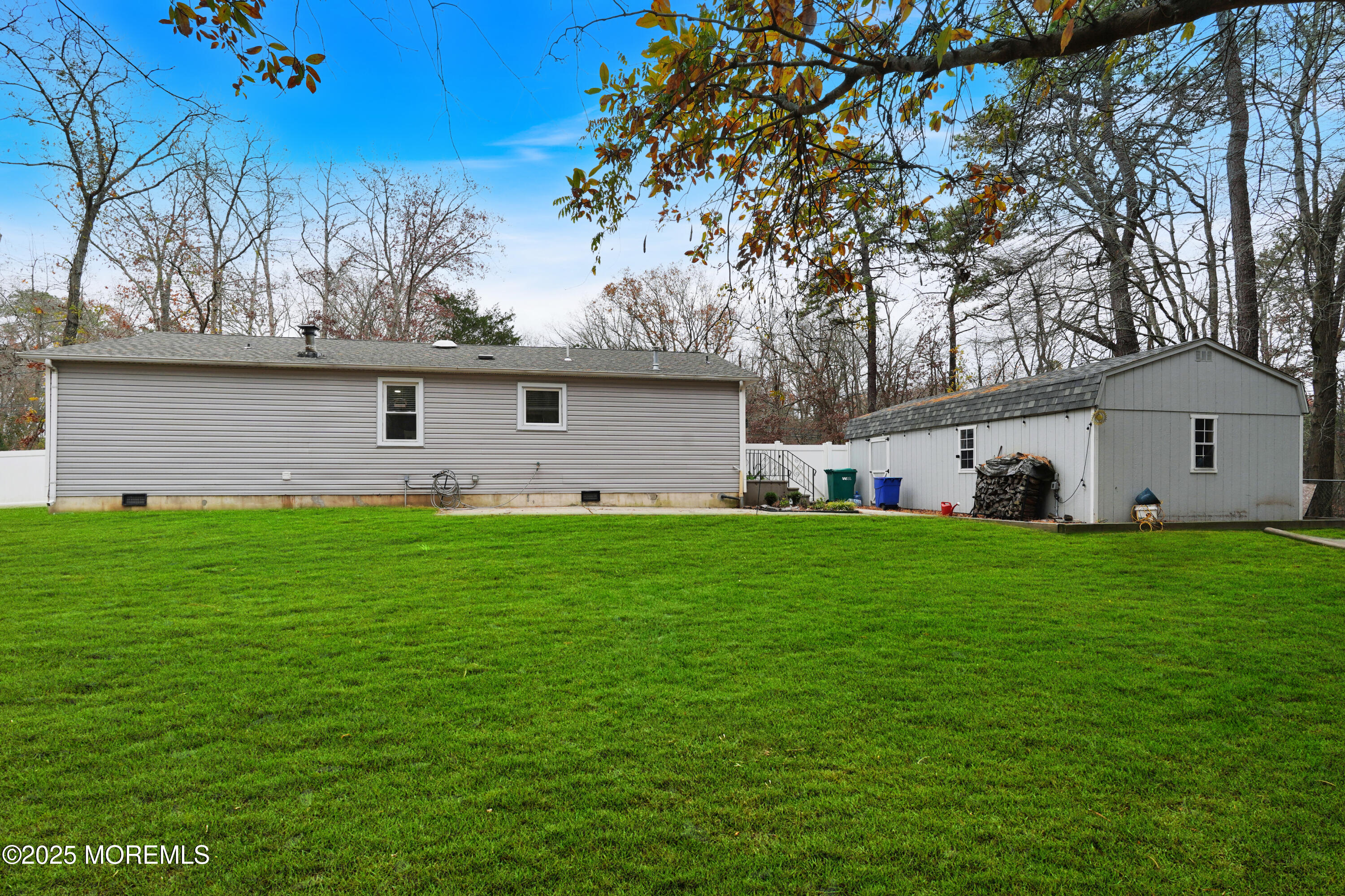 336 Jackson Mills Road Jackson, NJ 08527 - Photo 30 of 45 a front view of a house with a garden and yard