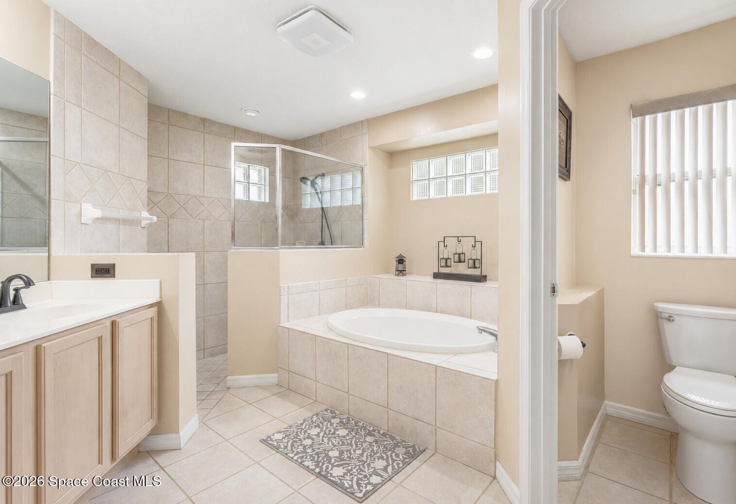 1697 Atrium Drive Melbourne, FL 32935 - Photo 19 of 36 Primary Bathroom 1